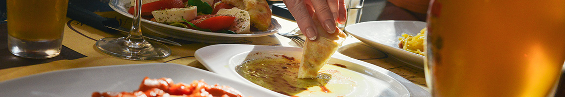 Eating Greek Hot Dog Mediterranean at Mr T's Gyros restaurant in Schiller Park, IL.